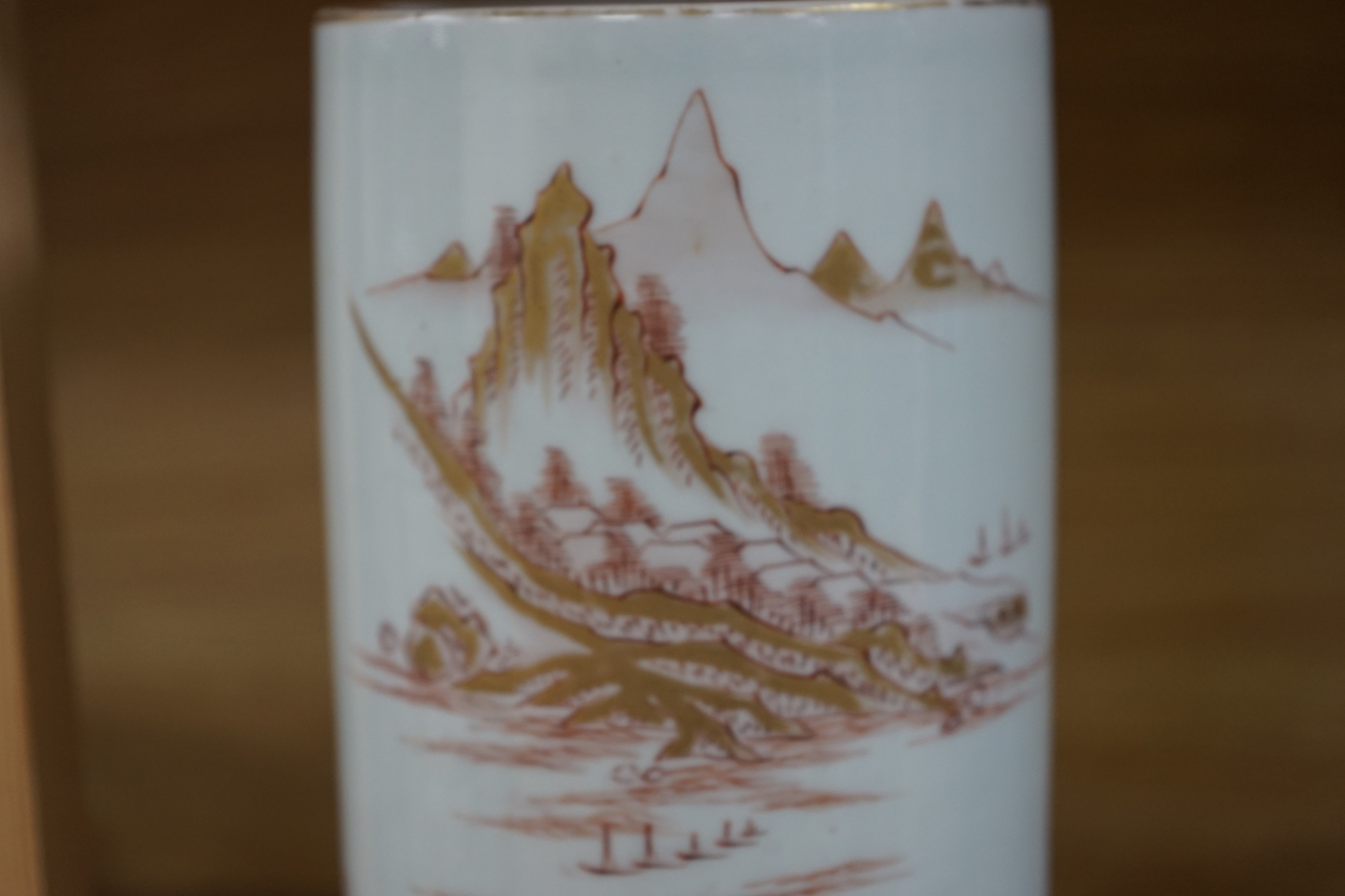 A Japanese porcelain cylindrical vase and a Chinese yellow ground two-section vessel and cover, 29cm